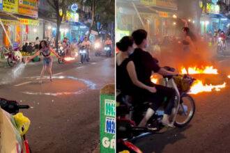 Girl did stunt by creating a circle of fire on the road